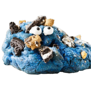 Blue cookie dough with cookie pieces and googly eyes resembling Cookie Monster.