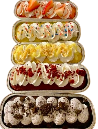 Assorted desserts topped with colorful fruits and cream in containers.