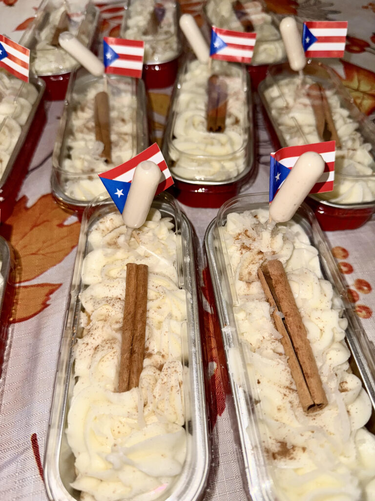Mini desserts topped with cinnamon sticks and festive decorations.